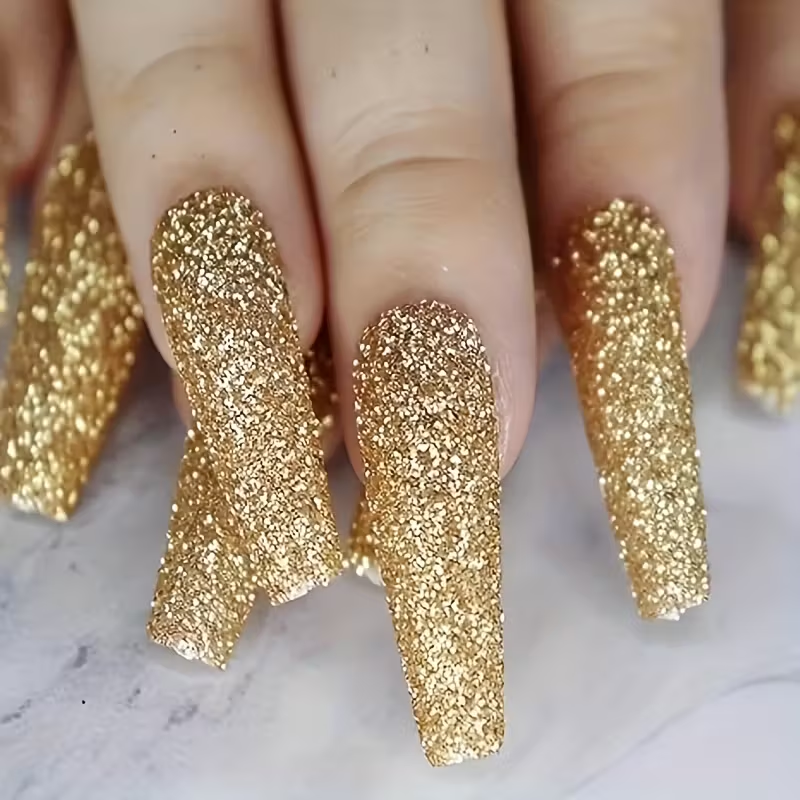 Short square nails with silver and gold snowflake holiday design